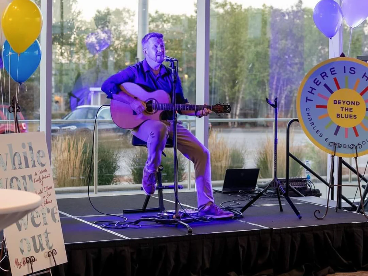 Phil Norby performing live acoustic music at a corporate event